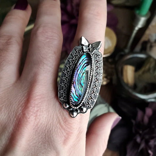 someone is holding a ring with a large abana abana abana abana abana abana aba