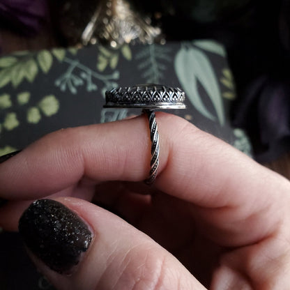 a person holding a ring in their hand