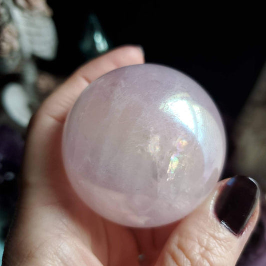 a person holding a large pink ball