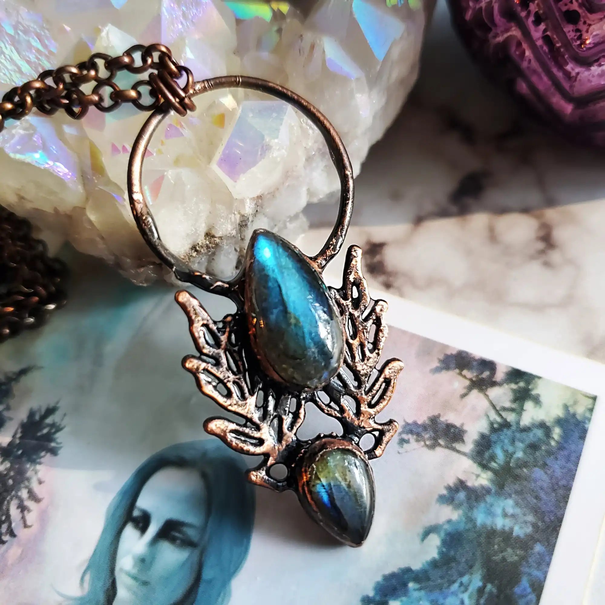 Copper and labradorite teardrop pendant on a chain.