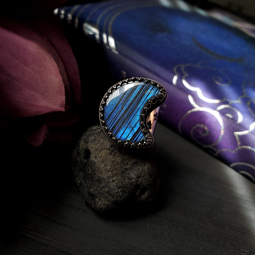 a ring with a blue stone on top