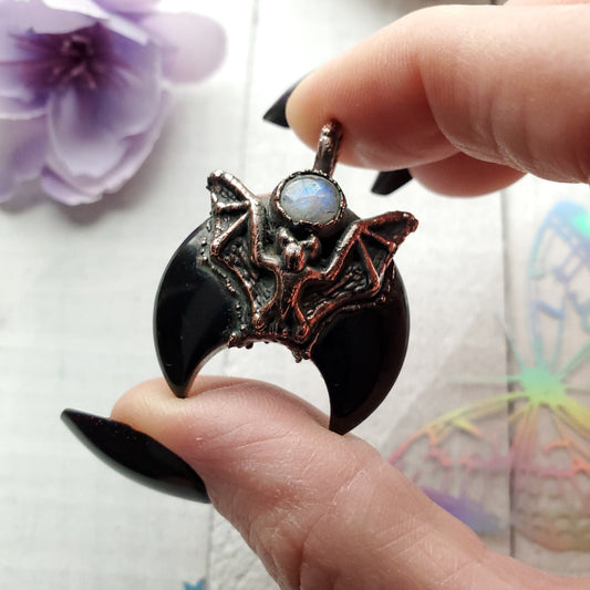 a person holding a ring with a dragon on it